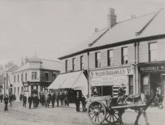 Station Road-Woodhorn Road, Ashington with Arrowsmiths on the corner next to Hillers' Bazaars Ltd.1930.JPG